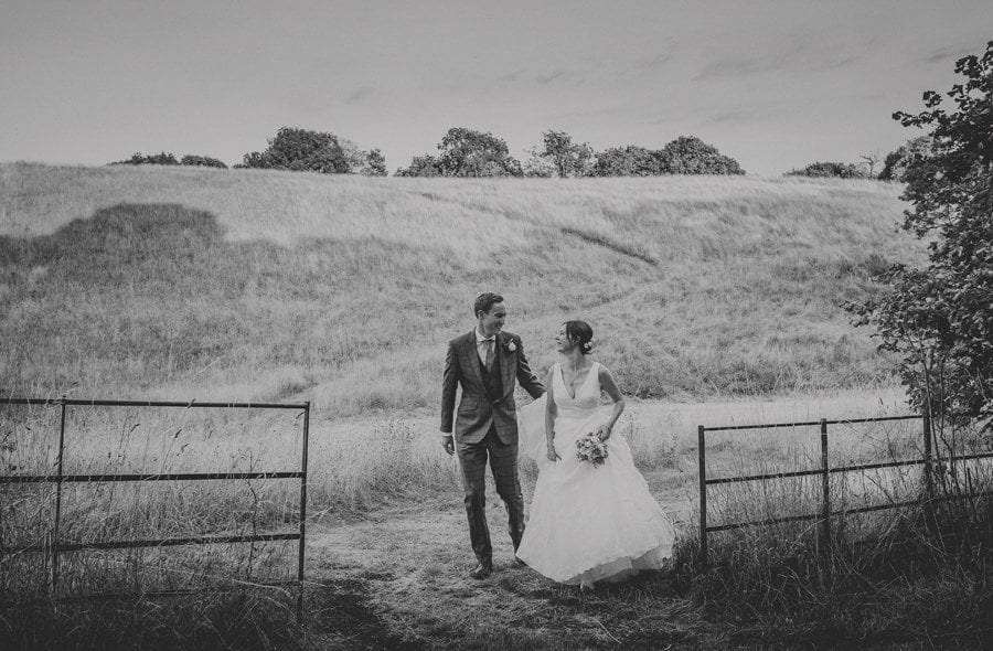 The bride and groom walk around the Estate at Hanham Court