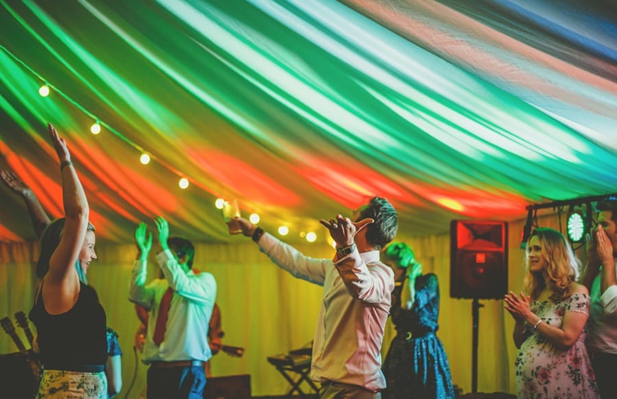 A wedding guest dancing in the marquee