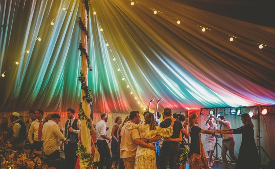 The wedding party dancing on the dancefloor