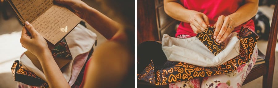 The bride opens a present given to her by the groom