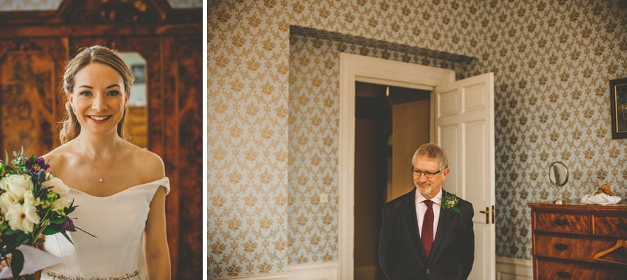The bride poses for a photograph and her father walks into the room