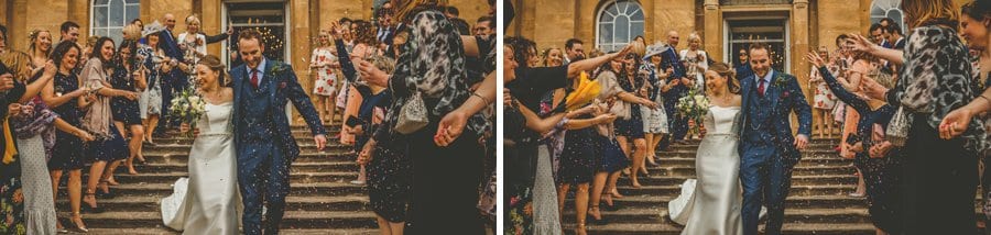 The wedding guests throw confetti over the bride and groom