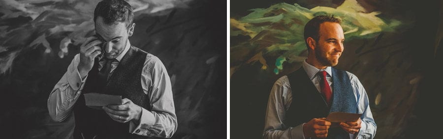 The groom looks at the bride and smiles during his wedding speech