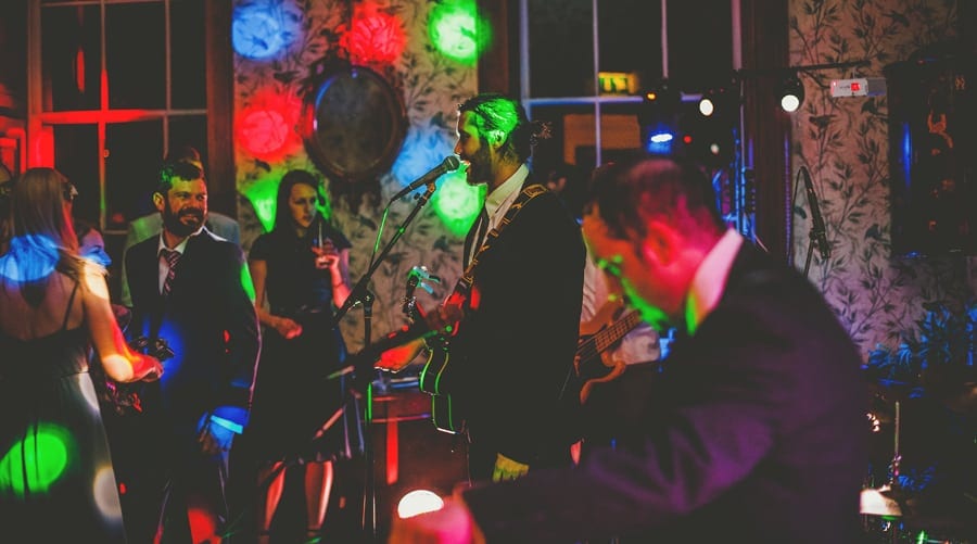 The wedding band perform a song for the wedding party at Kings weston House