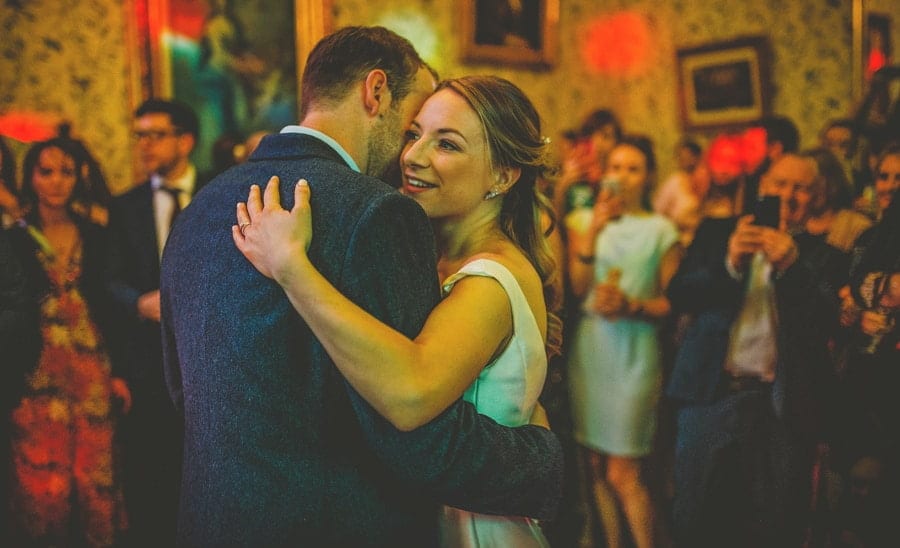 The bride and groom dance together on the dancefloor at Kings Weston House