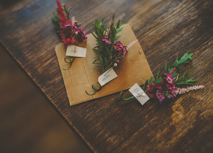 Little Quarme wedding photographer 0001 | somerset-wedding-photographer Wedding flowers on a wooden table at Little Quarme Cottages