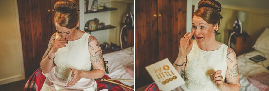 Little Quarme wedding photographer 0017 | somerset-wedding-photographer The bride sits on the end of the bed and cries as she reads a card that has been sent to her