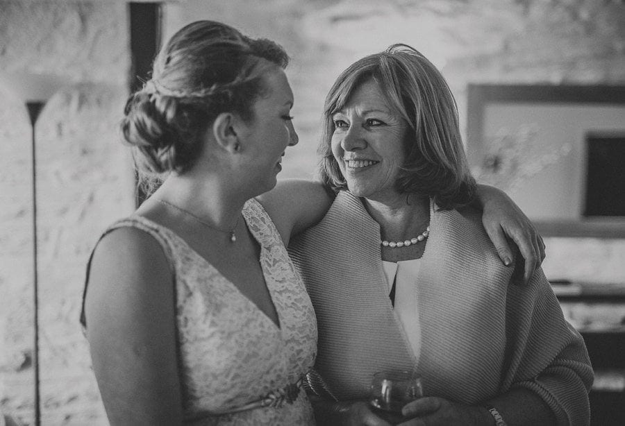 Little Quarme wedding photographer 0019 | somerset-wedding-photographer The bride puts her arm around her mother and laughs with her