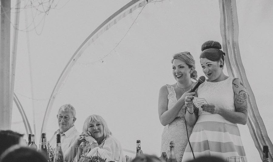 Little Quarme wedding photographer 0044 | somerset-wedding-photographer The wedding couple deliver their speech in the marquee at Little Quarme Cottages
