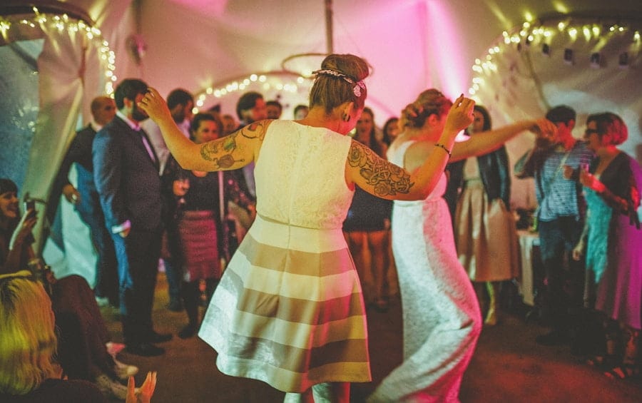 Little Quarme wedding photographer 0055 | somerset-wedding-photographer The bride and the bride dance together on the dancefloor in the outdoor marquee