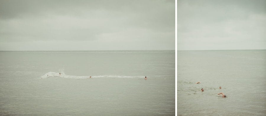 The groom and the ushers are hit by a small tidal wave in the sea at Lyme Regis