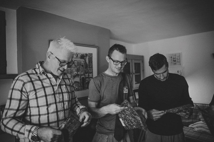 The ushers open their presents together