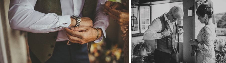 The bride's father places a watch onto his wrist