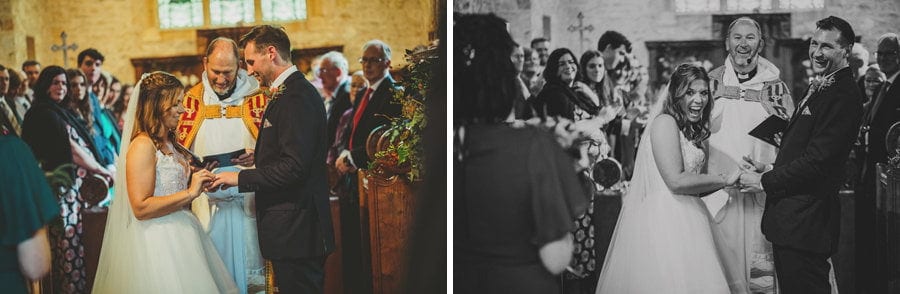 The bride and groom exchange rings during the wedding ceremony