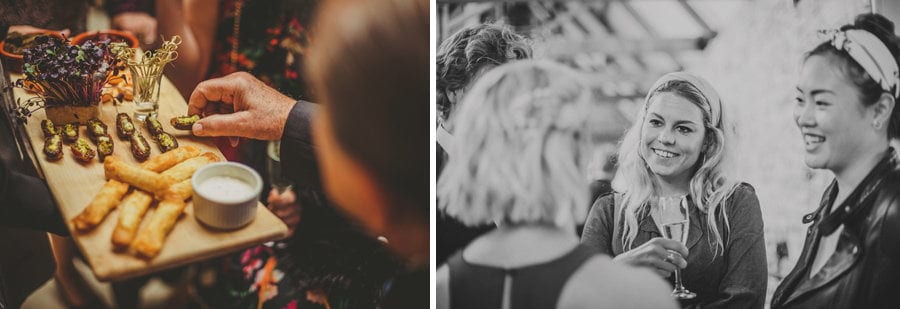 A wedding guest listens to another guest