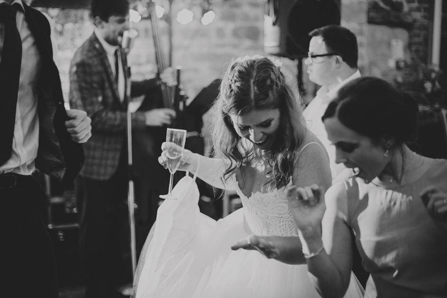 The bride dancing with a friend
