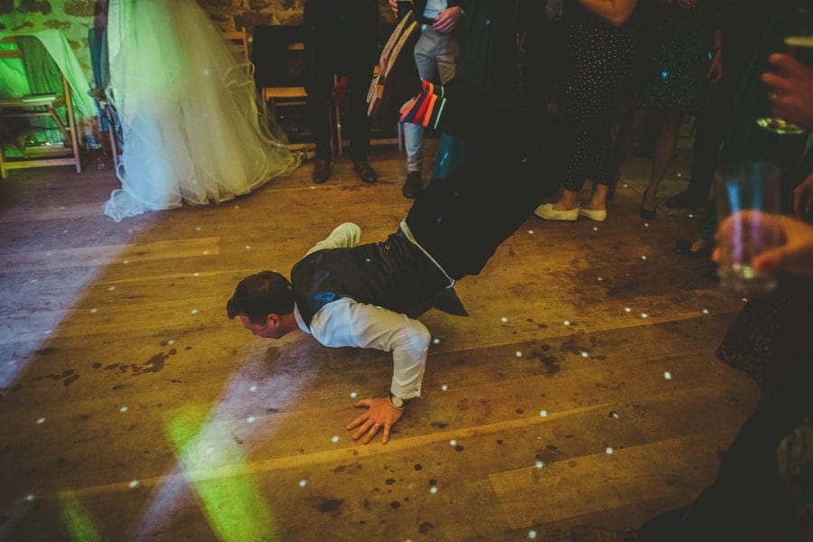 The groom throws himself onto the dancefloor