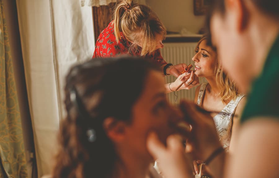 Bridesmaids having their makeup applied