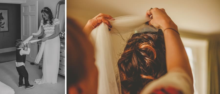 A bridesmaids places the veil over the brides head
