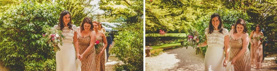 The bride and her bridesmaids walks through the gardens and towards the outdoor wedding ceremony