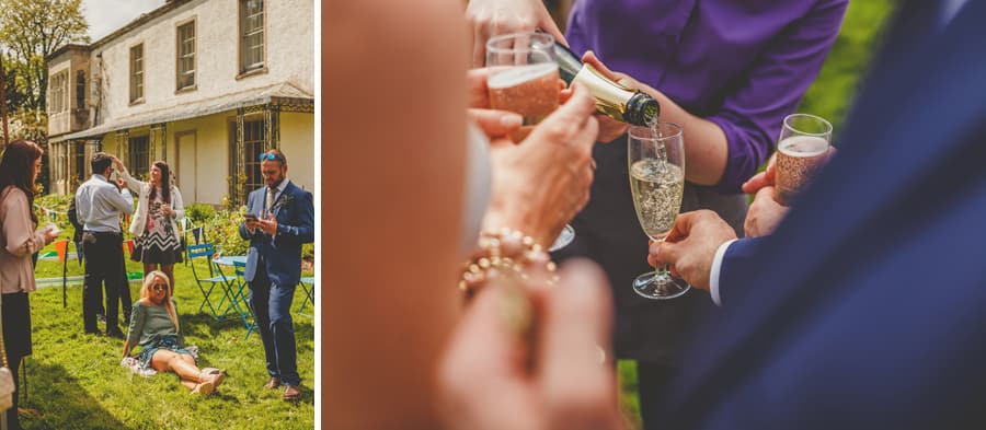 A member of staff pours champagne into flutes for the wedding guests
