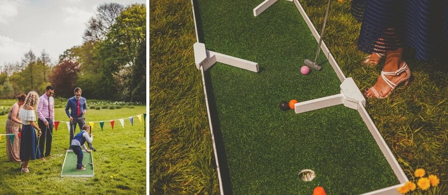 Wedding guests play crazy golf outside on the lawn at the Matara Centre