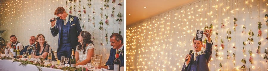 The groom shows the wedding guests a photograph during his speech