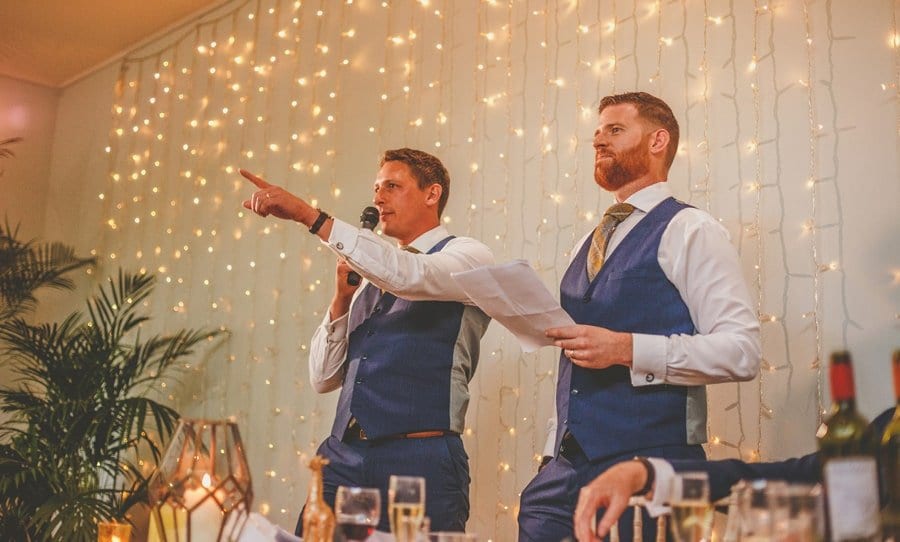 The best men deliver their speech to the wedding guests