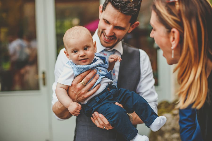 A man holds his child in his arms