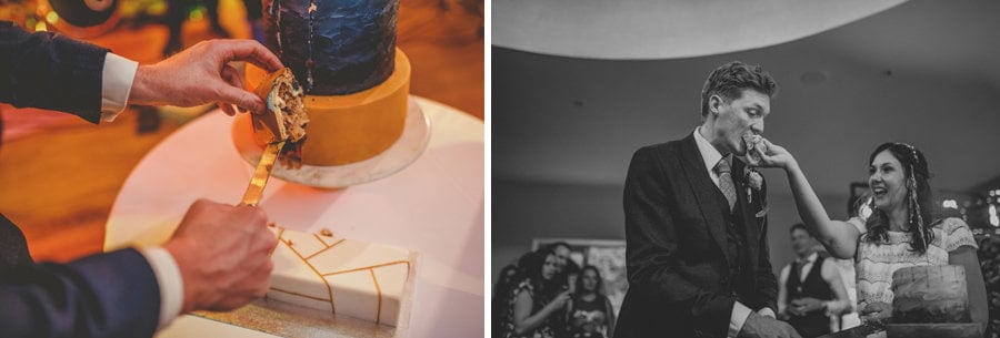 The bride puts a piece of wedding cake into her husbands mouth