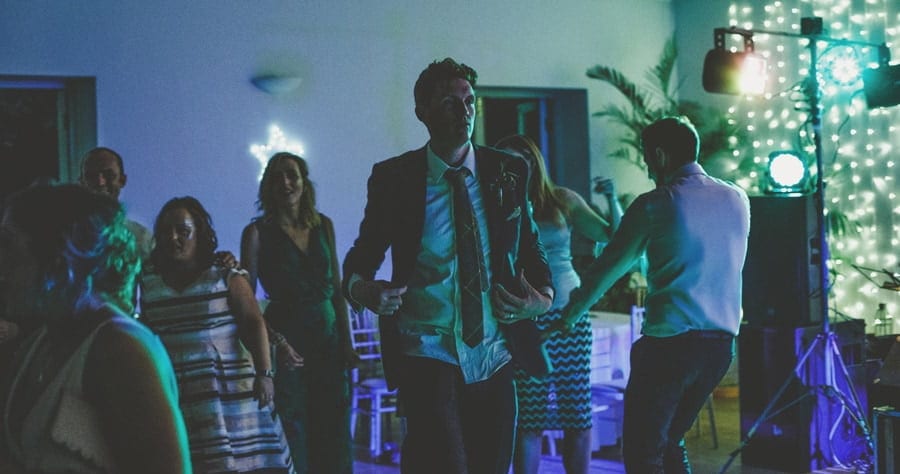 The groom walks along the dancefloor