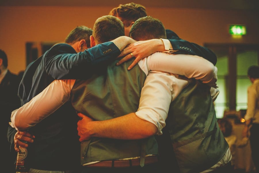 Men holding each other on the dancefloor
