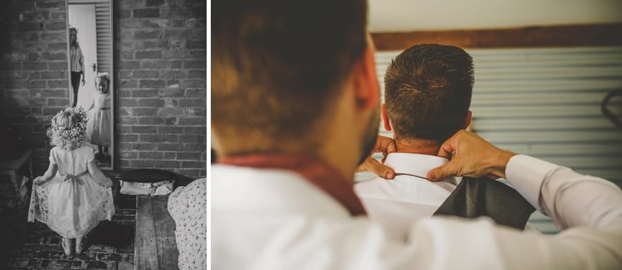 The flower girl looks in the mirror and an usher straightens the grooms collar