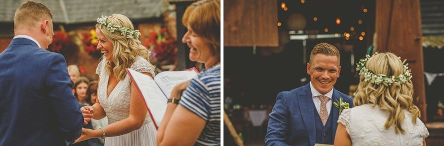 The bride and groom laugh with each other during the wedding ceremony at Over Barn
