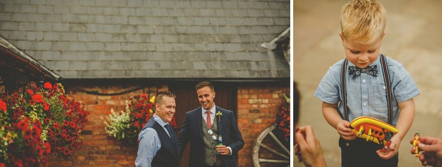 A little boy plays with a small plastic boat