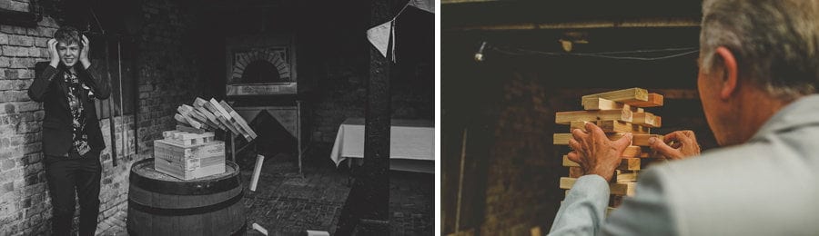 Wedding guests playing large Jenga at Over Barn