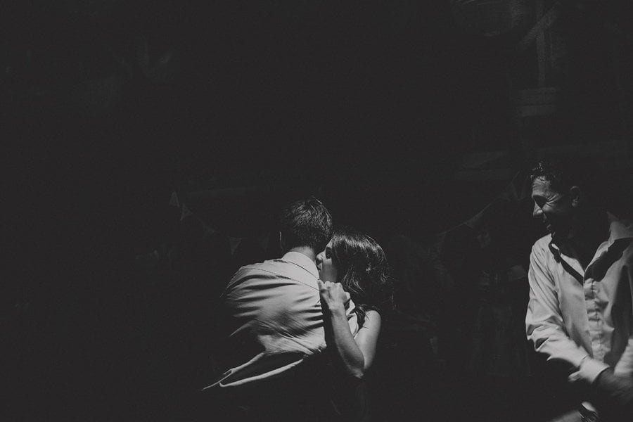 Wedding guests dancing on the dancefloor in the barn