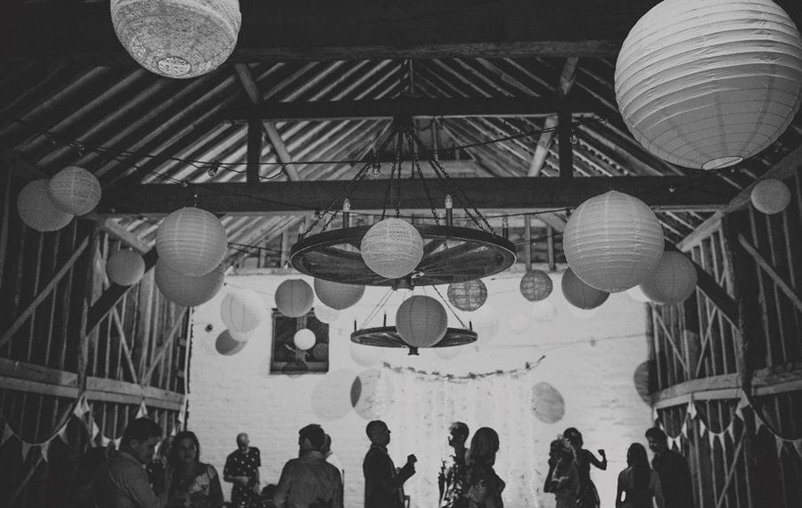 Wedding guests dancing at Over Barn in Gloucestershire