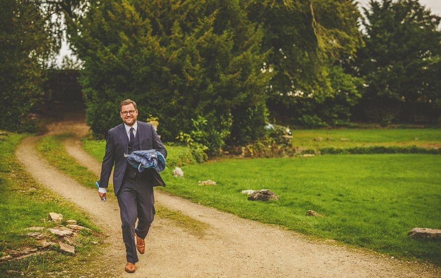 A family member of the bride arrives at the cottage