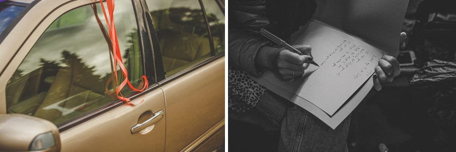 The wedding car with a ribbon hanging from the passenger window