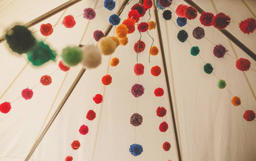 Wedding decorations hang from the ceiling of the marquee at Silk Mill Studios in Frome