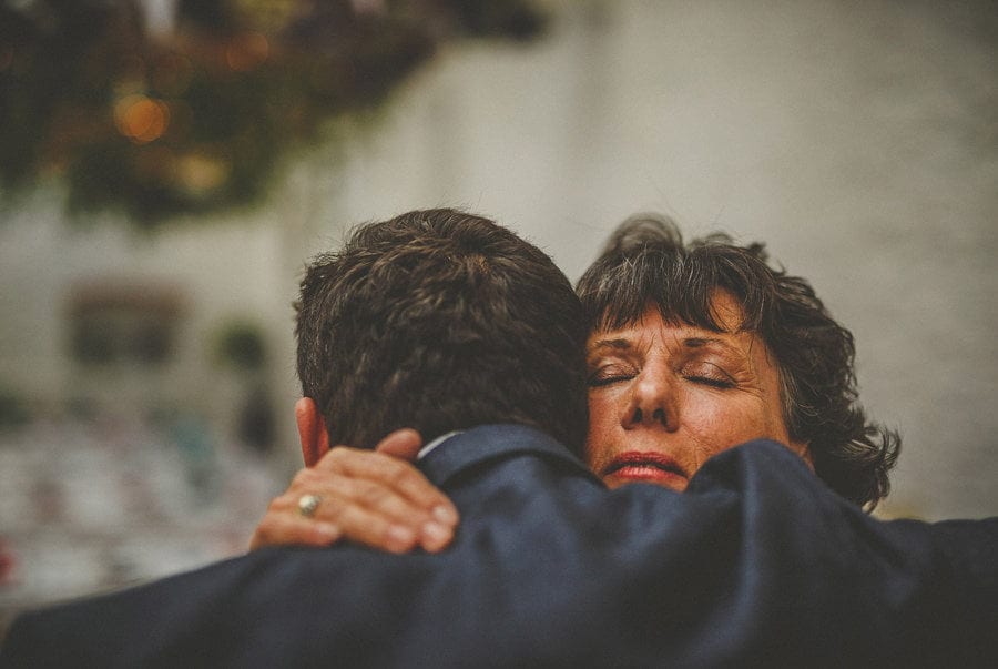 The brides mother greets the groom