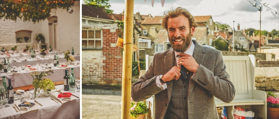 A wedding guest smiles and straightens his tie