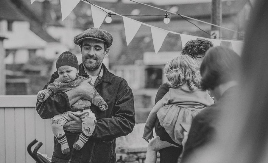 A man holds his little boy in his arms