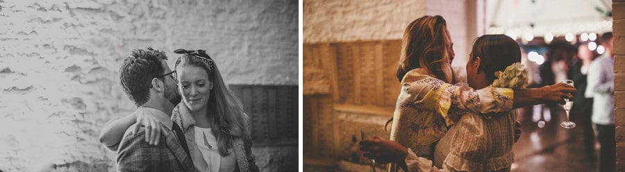 The bride puts her arms around one of the bridesmaids