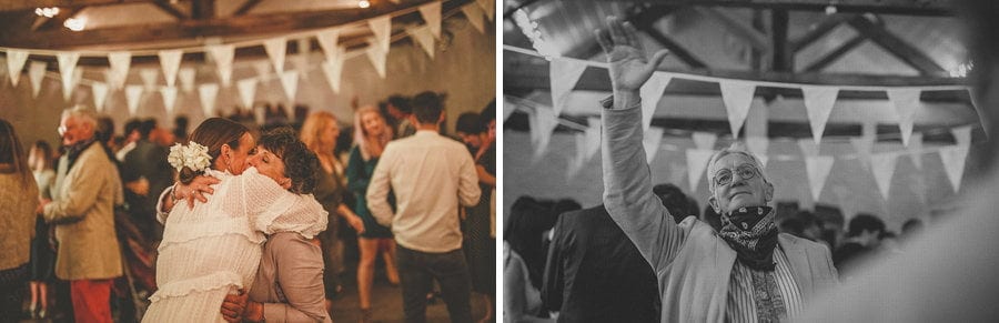 The bride and her mother hold each other in their arms at Silk Mill Studios