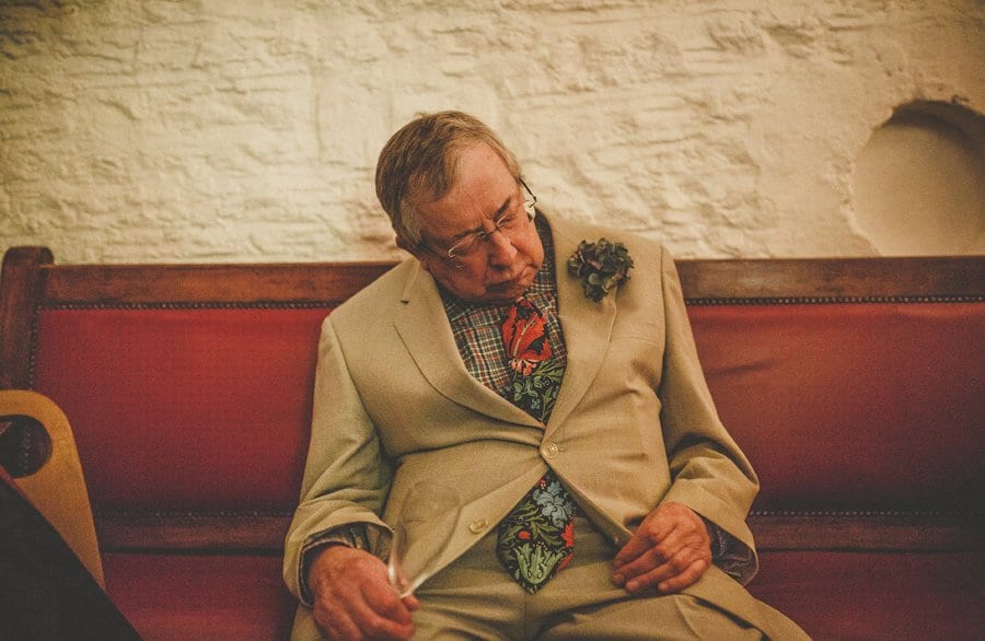 The brides father sleeps on a bench at Silk Mill Studios