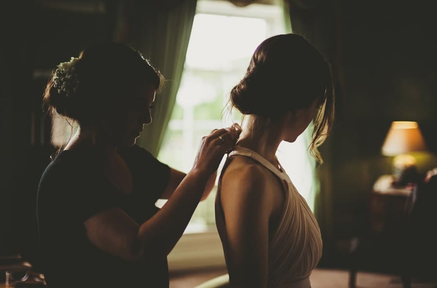 A bridesmaid gets ready in the Master bedroom
