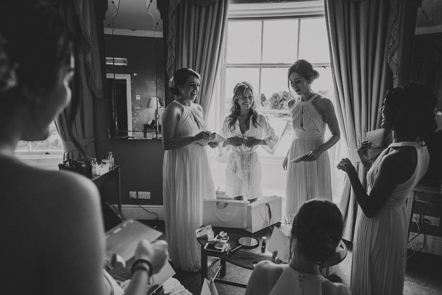 The bride and her bridesmaids get together and chat in the Master bedroom at Stubton Hall