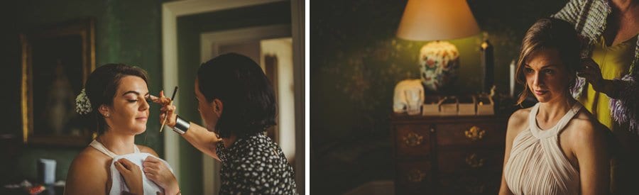 The hairdresser ties back the bridesmaids hair